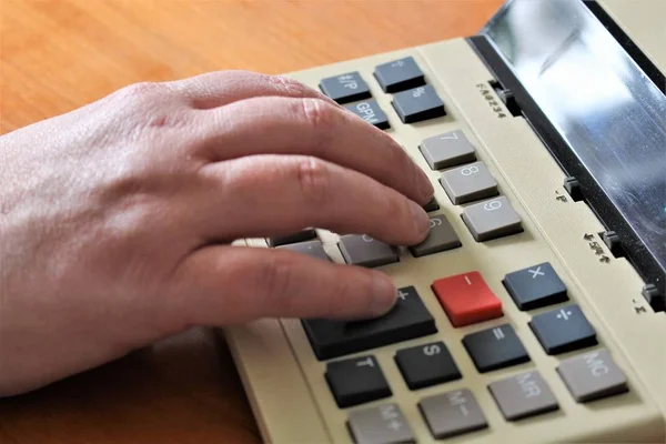 An Image of a Hand and a calculator - vintage — Stock Photo, Image