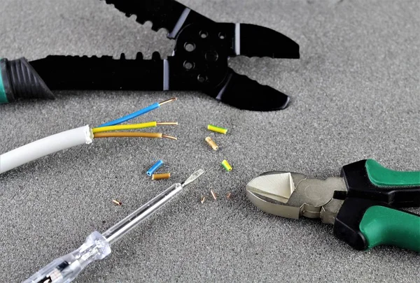 An image of electro cable, tools, repair