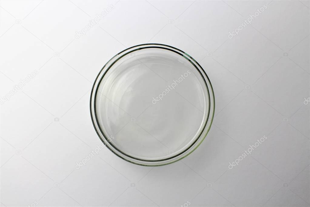 A Petri dish (aka Petrie dish, Petri plate or cell culture dish) cylindrical glass or plastic lidded dish used to culture cells such as bacteria or mosses