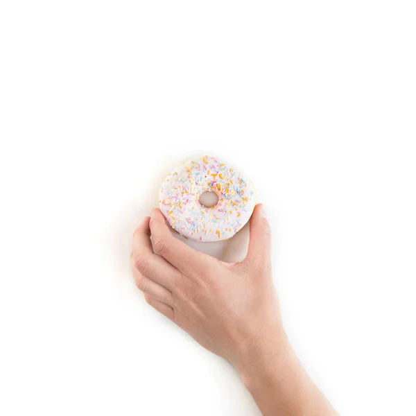 Cropped shot of person holding fresh tasty donut isolated on white — Stock Photo