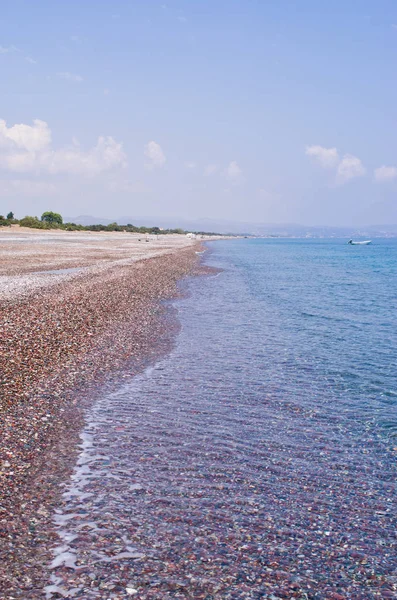 Pebble covered beach on Rhodes island, Greece