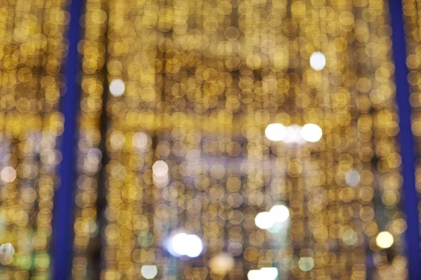 Golden glittering christmas lights. Blurred abstract background. Bokeh — Stock Photo, Image