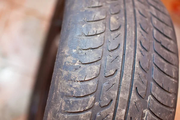 Old car tire with erased tread — Stock Photo, Image