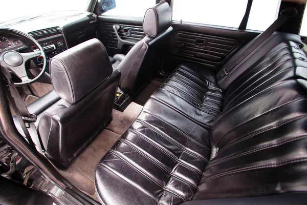 Black leather rear seats of retro car