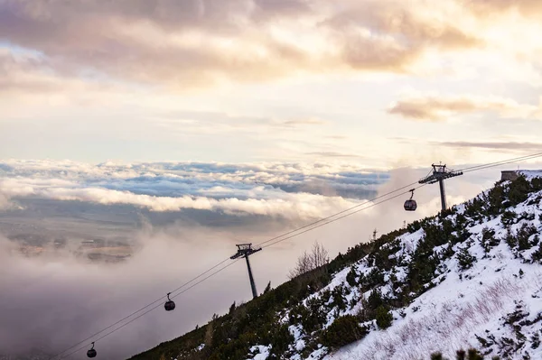 Lift to the peak of a mountain peak in the High Tatras at sunset