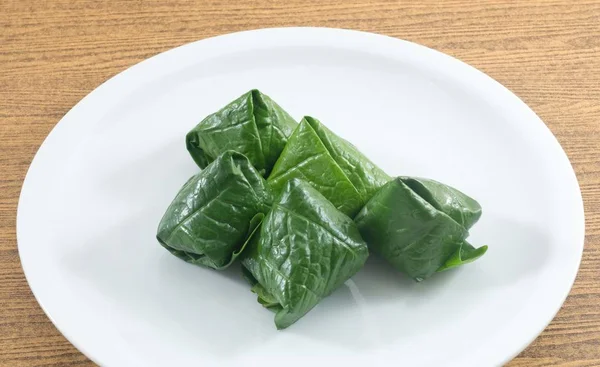 Dish of Spicy Betel Leaf Wrapped Bite Size Appetizer