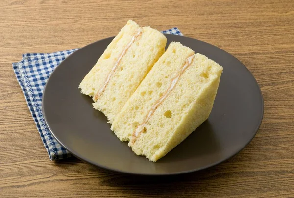 Vanilla Chiffon Cake on A Black Dish