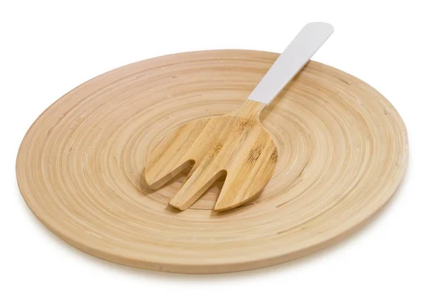 Posate con forchetta in legno su un piatto di legno — Foto Stock