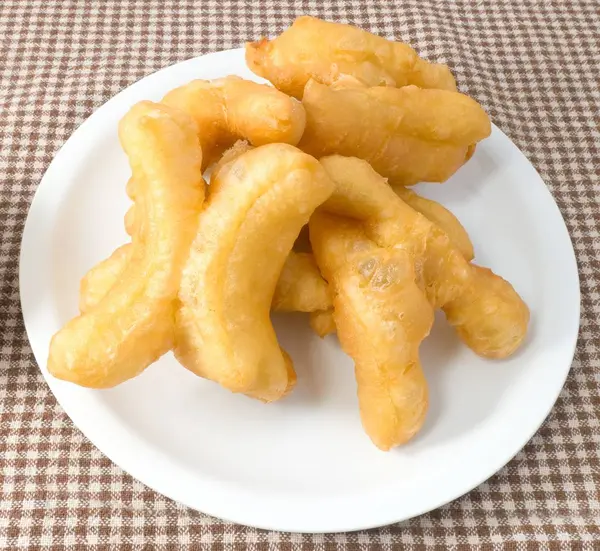 Delicious Deep Fried Doughstick on A White Dish — Stok Foto