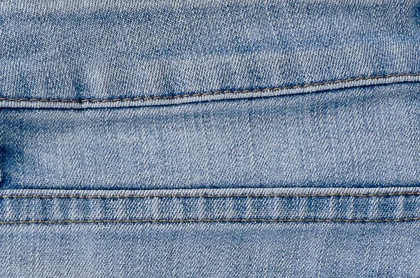 Textura Jean Denim azul de cerca con costuras — Foto de Stock