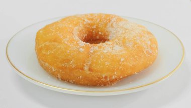 Şeker beyaz çanak üzerinde sırlı Donut