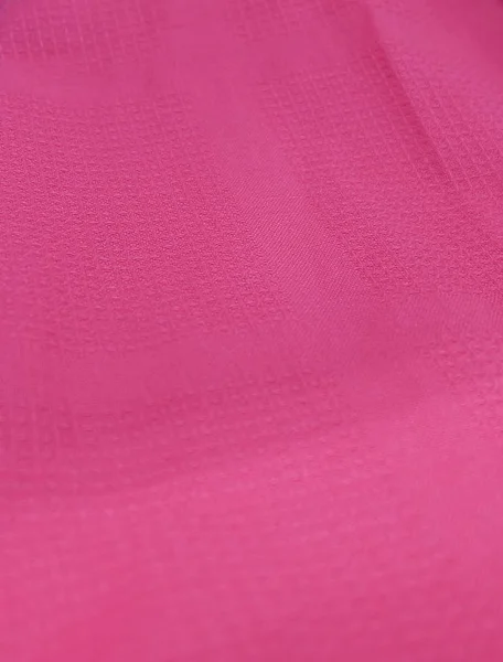 Close-up van de achtergrond van roze textiel textuur — Stockfoto