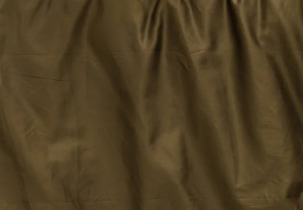 Patroon van de achtergrond van verfrommeld bruin textiel textuur — Stockfoto