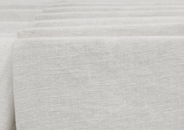 Stos białe bawełniane tkaniny w podszewka — Zdjęcie stockowe