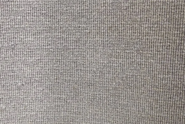 Textura Antecedentes de un felpudo tejido gris — Foto de Stock