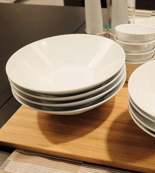 Set of Porcelain Plates, Bowls and Silverware