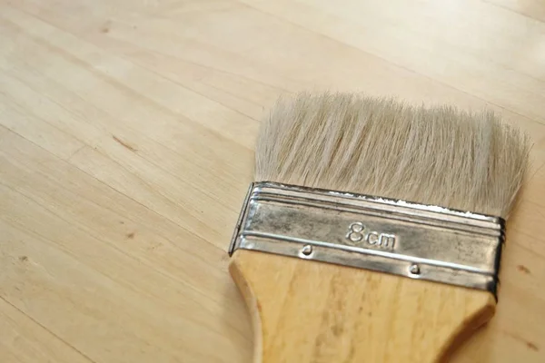 Flat Paint Brush or Decorators Brush on Table — Stock Photo, Image