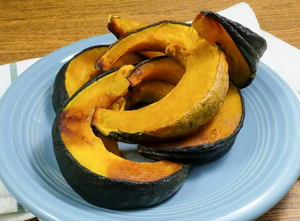 Delicious Baked Slices of Pumpkin on Dish — Zdjęcie stockowe