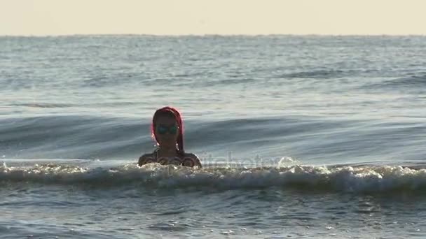 Young beautiful redhead woman in sea waves in slow motion — Stock Video