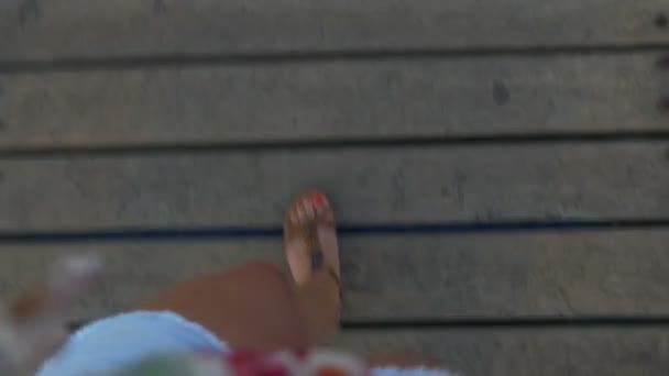 Pov feet of a woman walking on a pontoon — Stock Video