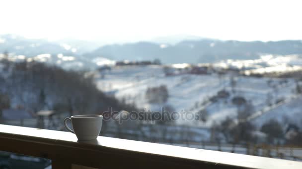 Cup of hot coffee on wooden railing — Stock Footage Cup of hot coffee on wooden railing Royalty Free Stock Video