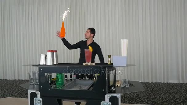 Flair bartending show with bottles and fireworks in slow motion at a party — Stock Video