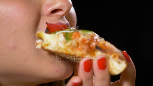 Closeup view of young woman mouth eating pizza