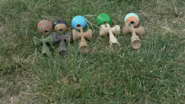 Closeup of five colorful kendama recreational toys — Stock Video