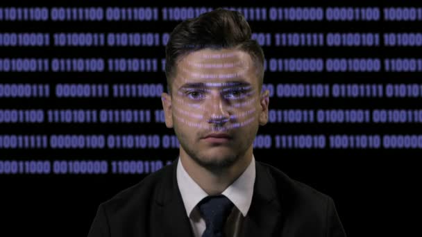 Corporate male developer programmer codding on futuristic holographic display on a dark background with blue binary code — Stock Video