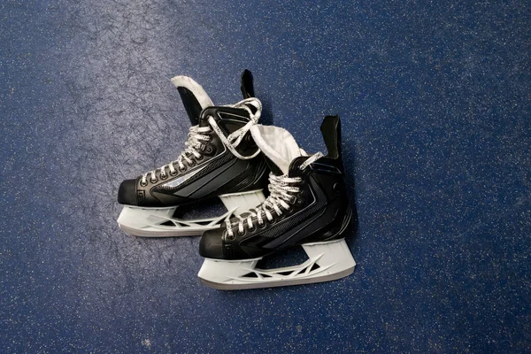 Hockey Skates Lying Floor Locker Room Blue Background Copy Space — Stock Photo, Image