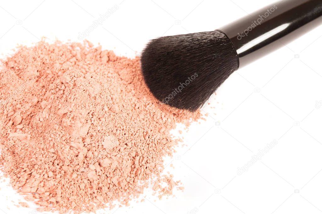 Powder blush and black makeup brush