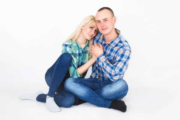 Romantic young couple sitting on floor. — Stock Photo, Image