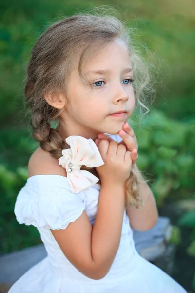 Cute little girl on nature in summer day — Stock Photo, Image