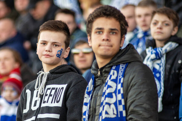 MINSK, BELARUS - APRIL 7, 2018: FC Dynamo Minsk fans during the Belarusian Premier League football match between FC Dynamo Minsk and FC Isloch at the FC Minsk Stadium