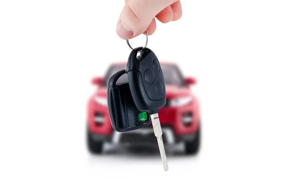 Mão segurando as chaves do carro novo. Compra ou venda de compositio de negócios — Fotografia de Stock