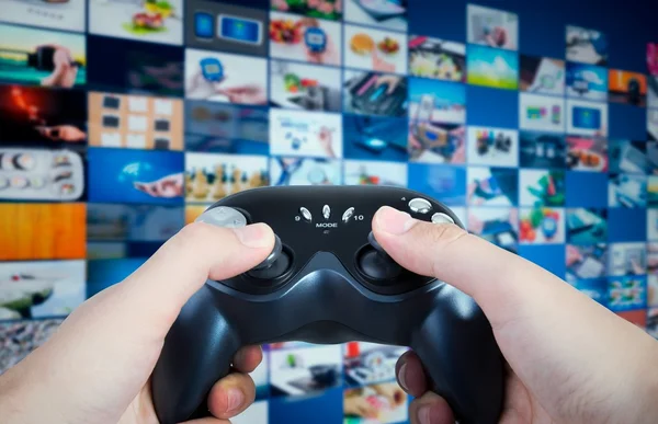 Gamer holding game pad in hands. Game play controller with streaming multimedia — Stock Photo, Image