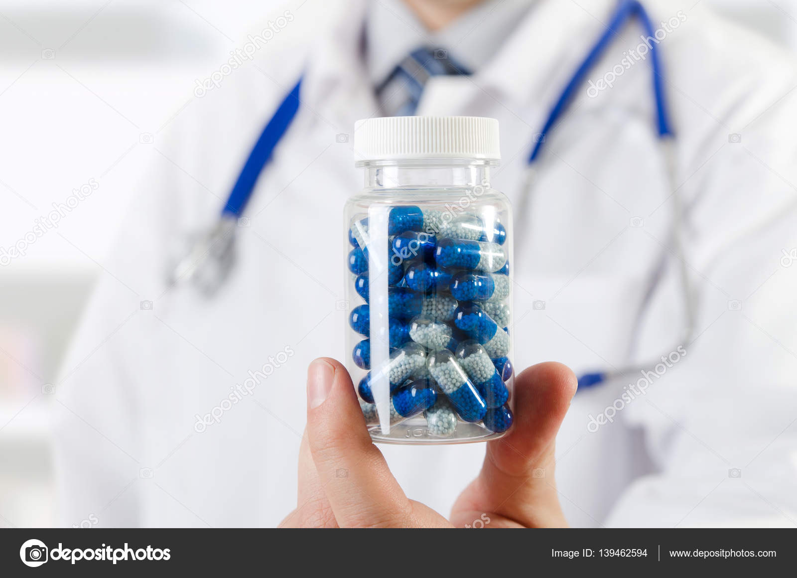 Doctor scientist invented new drug, holds capsule in hands Stock Photo