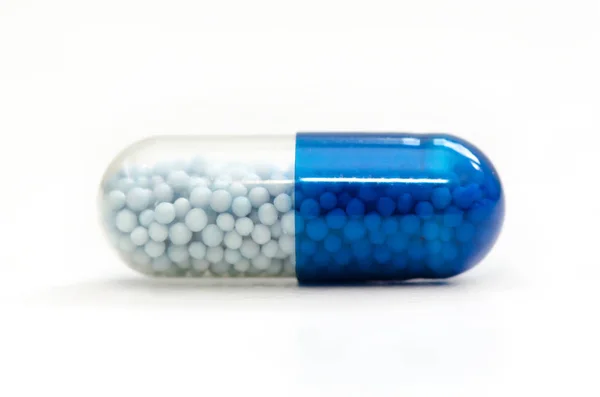 Un montón de pastillas cápsulas de cerca —  Fotos de Stock