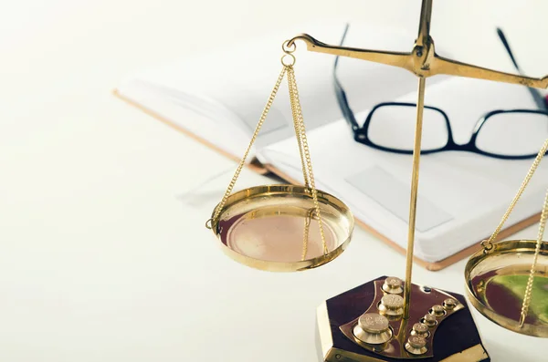 Law scale justice with book and glasses in background. — Stock Photo, Image
