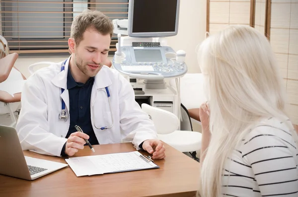 Pregnant woman in doctor's office.