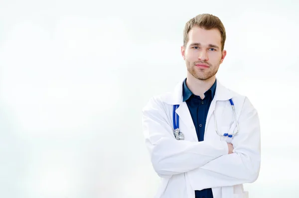 Handsome young doctor in office — Stock Photo, Image