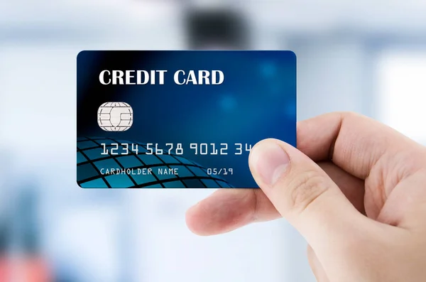 Hand holding plastic credit card — Stock Photo, Image