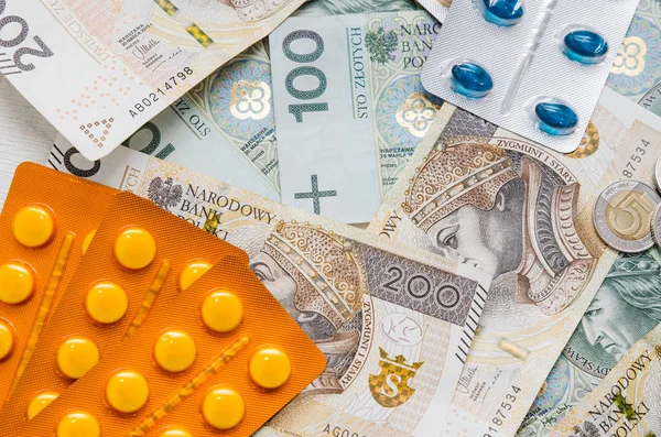 Pills and polish zloty bills — Stock Photo, Image