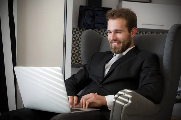 Young business man working from home with laptop — Stock Photo, Image