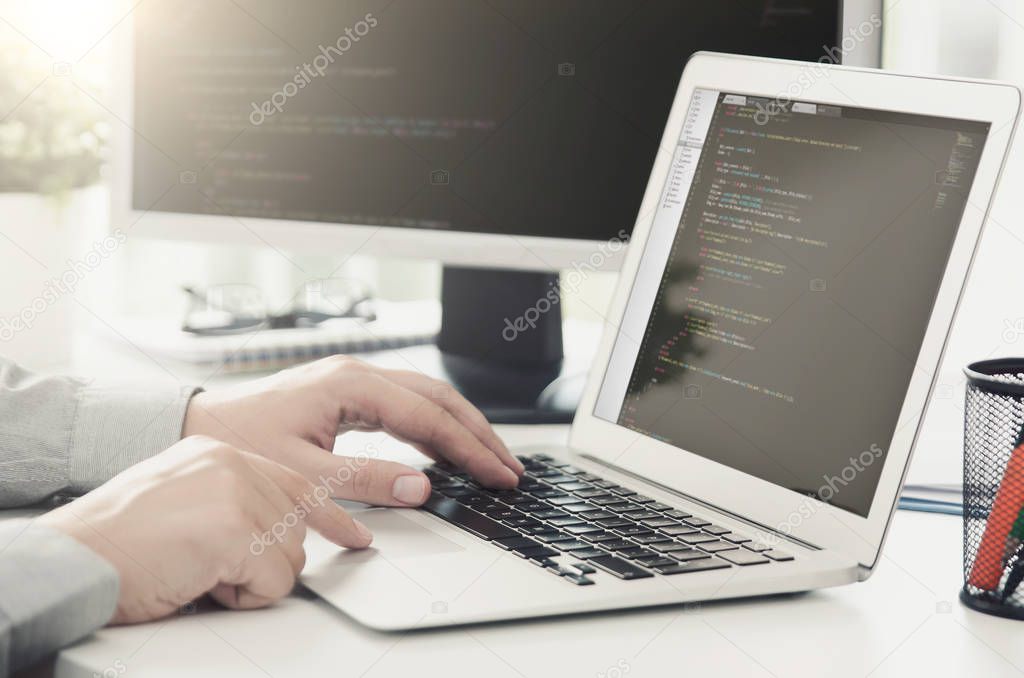 Programmer working busy software developing in company office