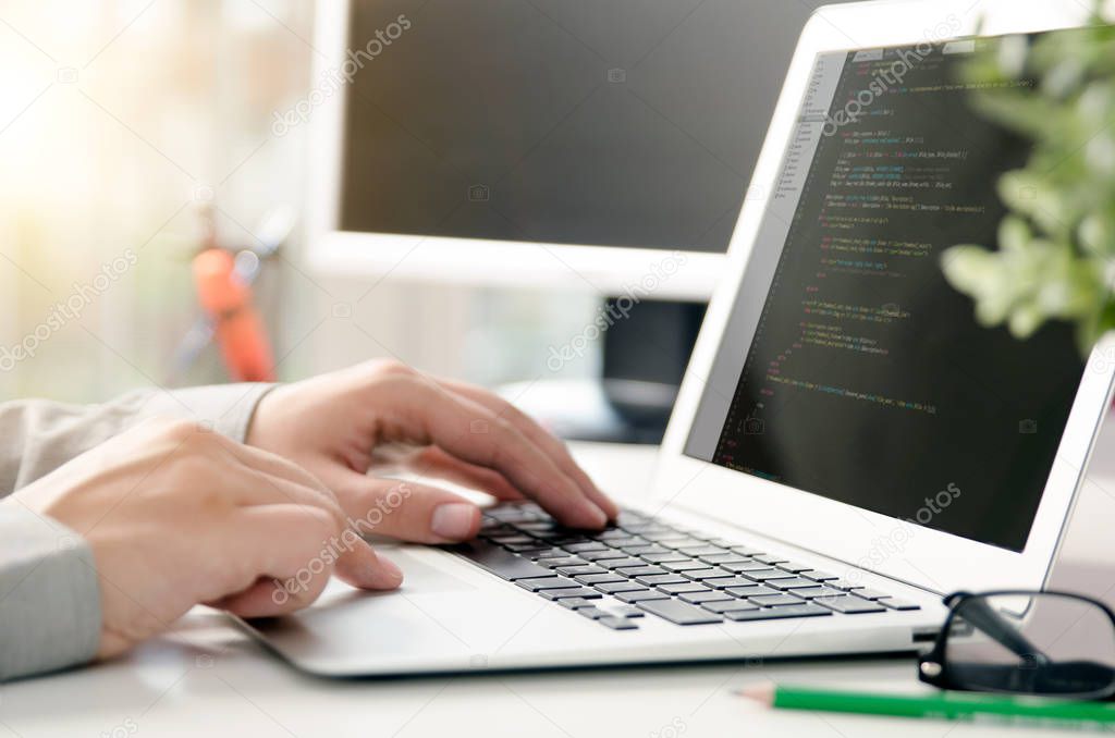 Programmer working busy software developing in company office