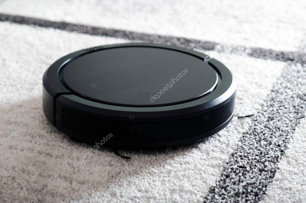 Robotic vacuum cleaner on carpet