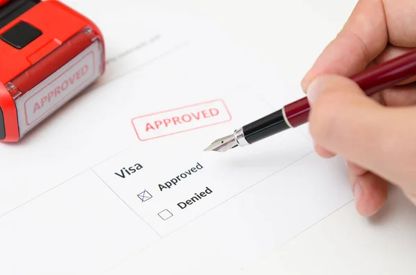 Visa and approved stamp on a document form — Stock Photo, Image