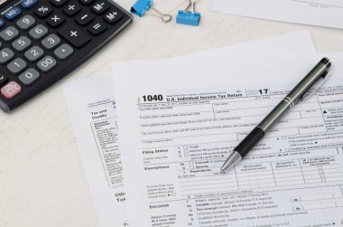 bize kalem ve hesap makinesi ile form 1040 vergi