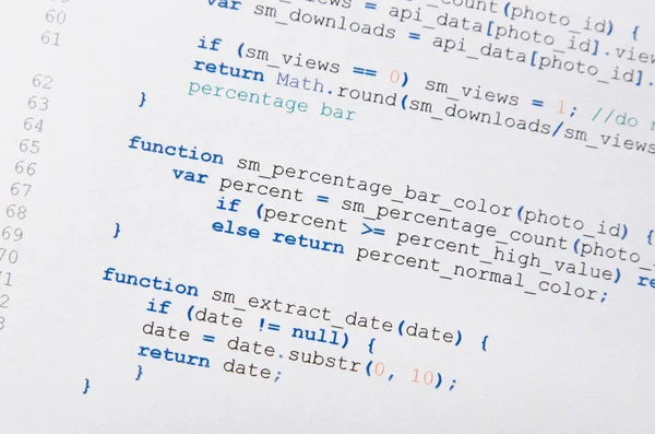 Web developer programming code printed on a piece of paper — Stock Photo, Image